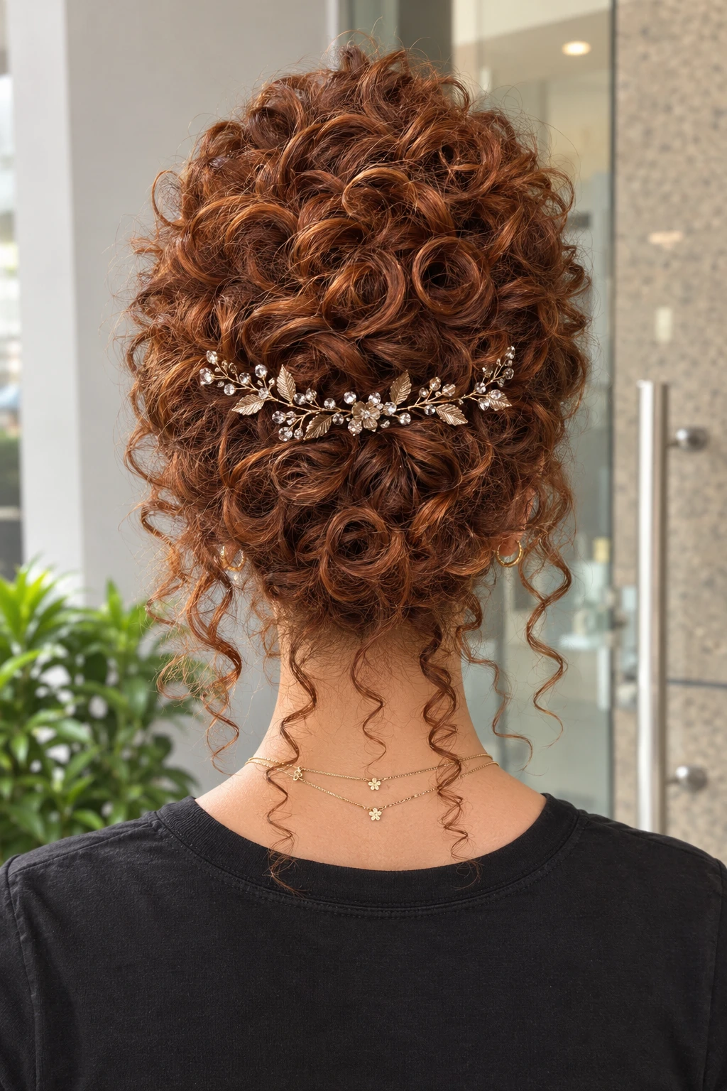 Curly Copper Updo with Floral Hair Vine