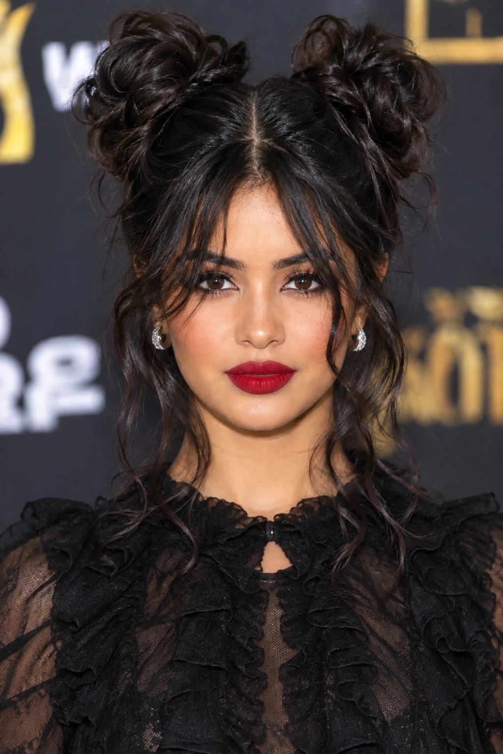 Messy Space Buns with Wispy Face Framing Waves